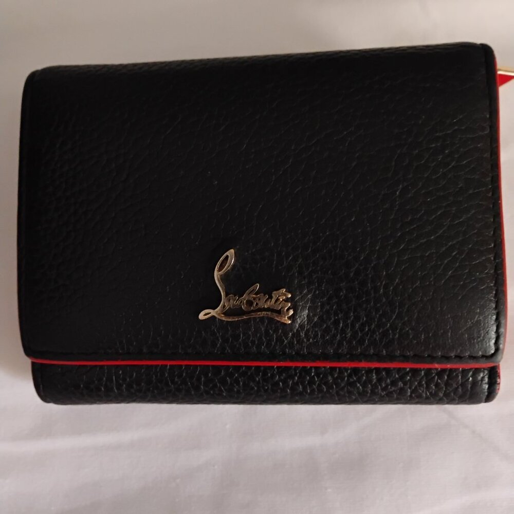 Authentic Christian louboutin black and red wallet.